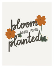 Load image into Gallery viewer, An art print featuring the popular quote, “Bloom where you’re planted,” written in calligraphy and decorated with orange flowers and green leaves.
