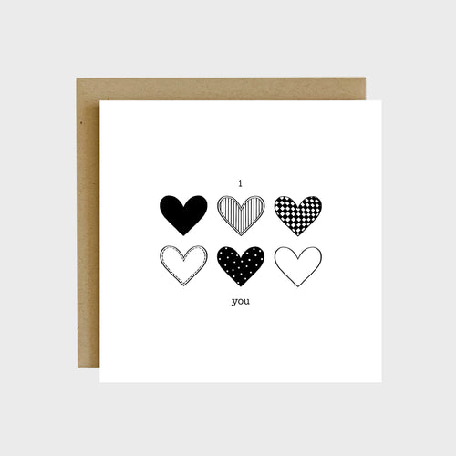 A greeting card featuring six hearts with six different patterns and text that reads, I heart you.