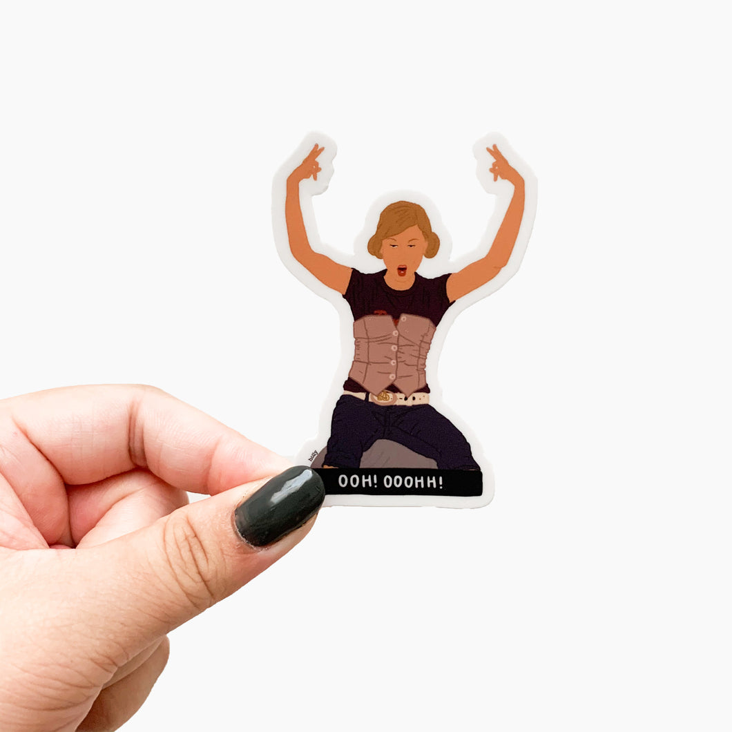 A funny sticker from the movie, Baby Mama, featuring Amy Poehler sitting on a fitness ball with her arms up and text that reads, Oooh! Ooohh!