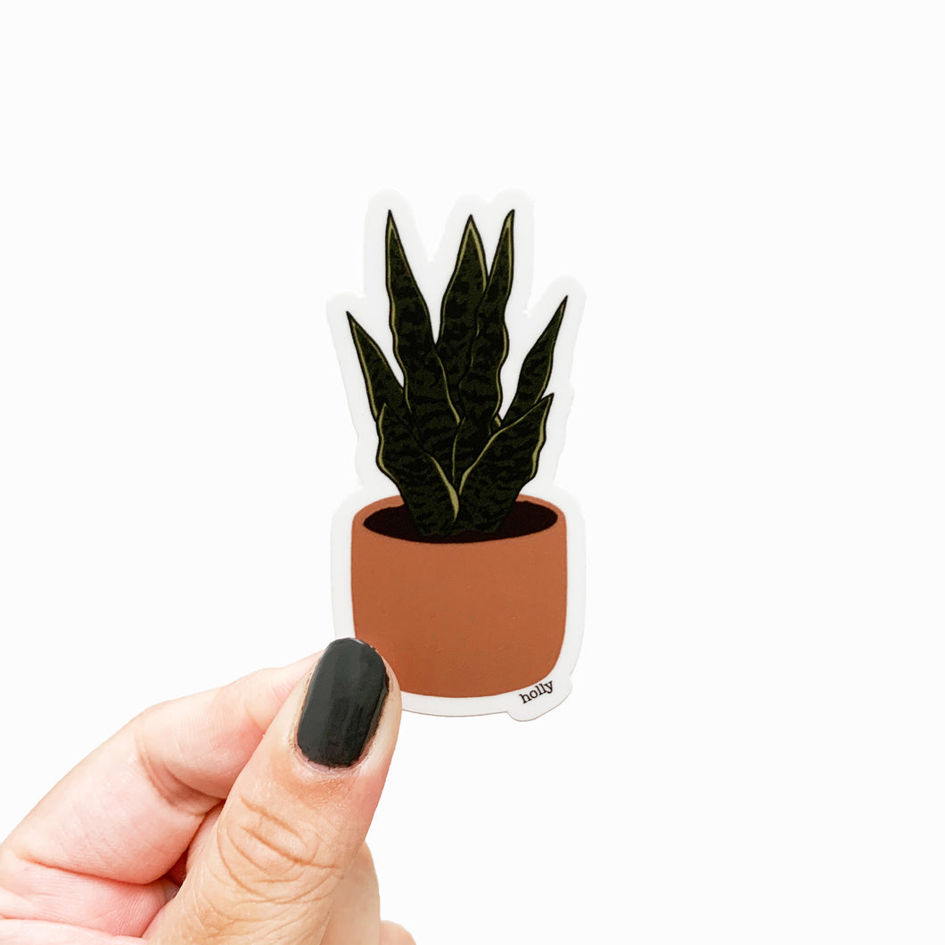 A sticker featuring a snake plant in a terracotta planter.