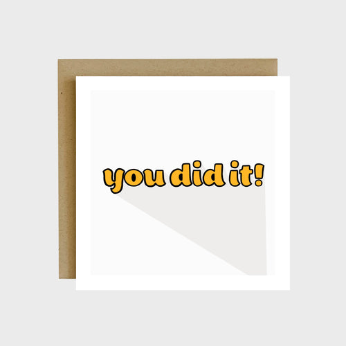 A greeting card featuring yellow retro bubble text that reads, You did it!