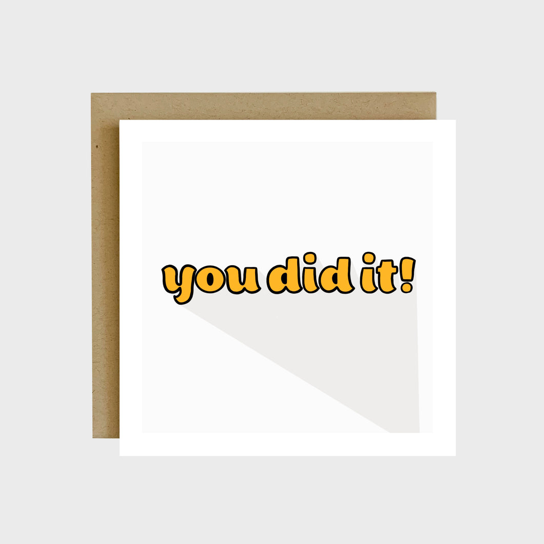 A greeting card featuring yellow retro bubble text that reads, You did it!