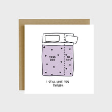 Load image into Gallery viewer, A funny greeting card featuring a bed split with one side getting 80% and the other getting 20% of the bed and text that reads, Your side my side, I still love you though.
